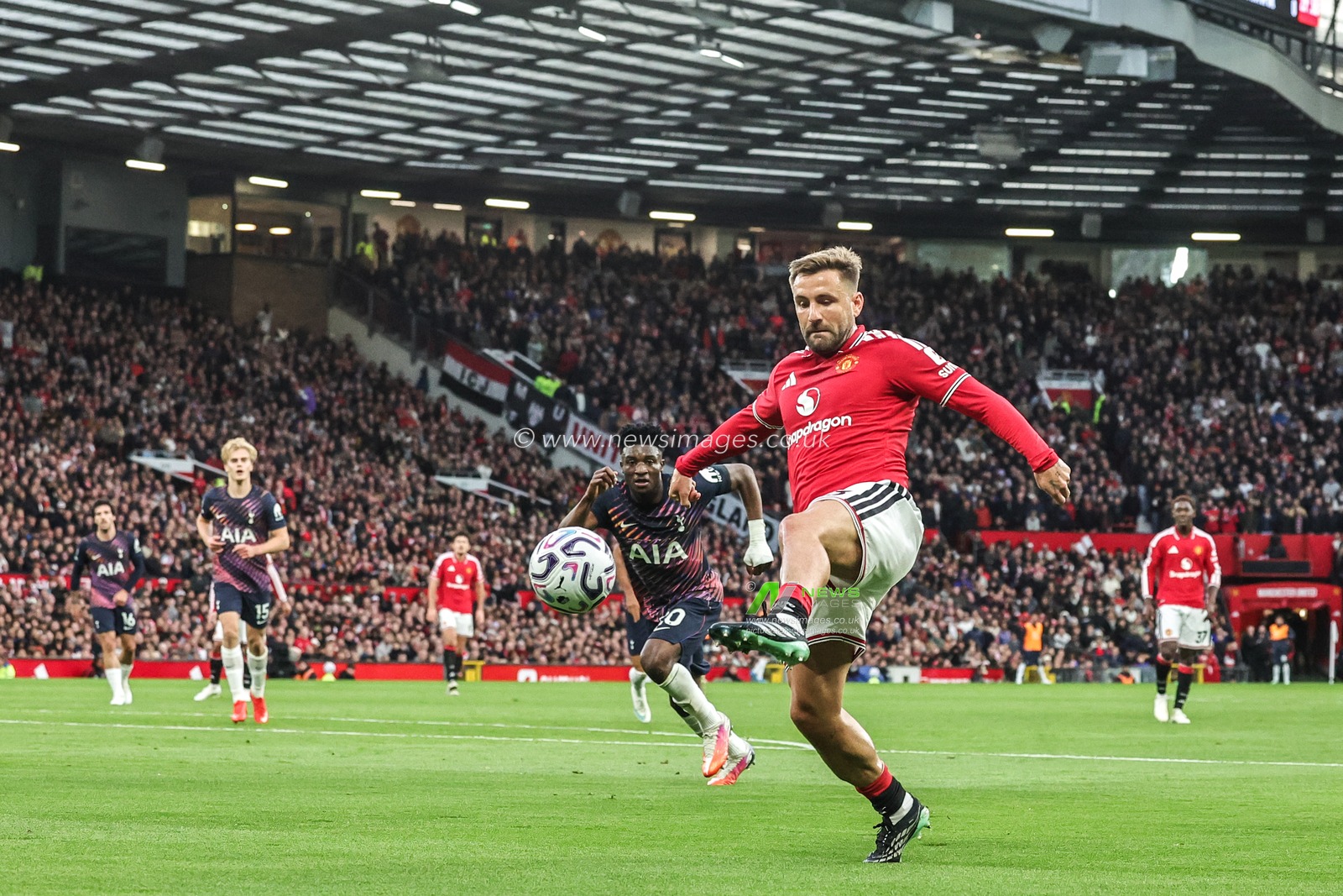Luke Shaw of Manchester United crosses the ball into the box during the Premier League match Manchester United vs Tottenham Hotspur at Old Trafford, Manchester, United Kingdom on 10 October 2026

(Photo by Mark Cosgrove/News Images)