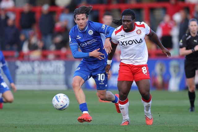 Reggie Walsh of Wigan Athletic and Daniel Phillips of Stevenage battle during the Sky Bet League One match Stevenage vs Wigan Athletic at Lamex Stadium, Stevenage, United Kingdom on 10 October 2026

(Photo by Harvey Murphy/News Images)