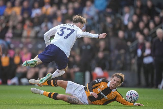 James Garner of Everton is tackled by  Regan Slater of Hull City during the Premier League match Hull City vs Everton at MKM Stadium, Hull, United Kingdom on 11 October 2026

(Photo by Maynard Manyowa/News Images)