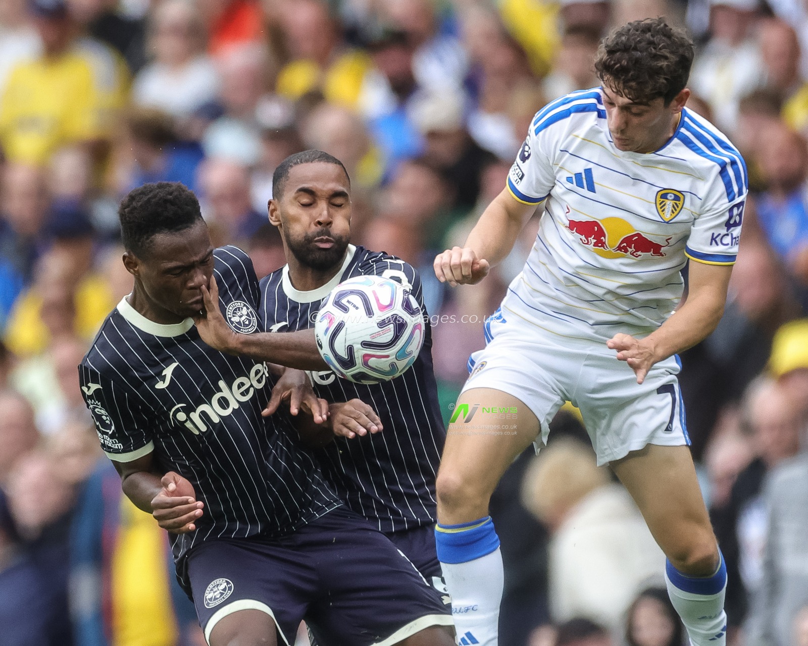 Mamadou Sangare of Brentford Rico Henry of Brentford and Daniel James of Leeds United battle for the ball during the Premier League match Leeds United vs Brentford at Elland Road, Leeds, United Kingdom on 30 August 2026

(Photo by Mark Cosgrove/News Images)