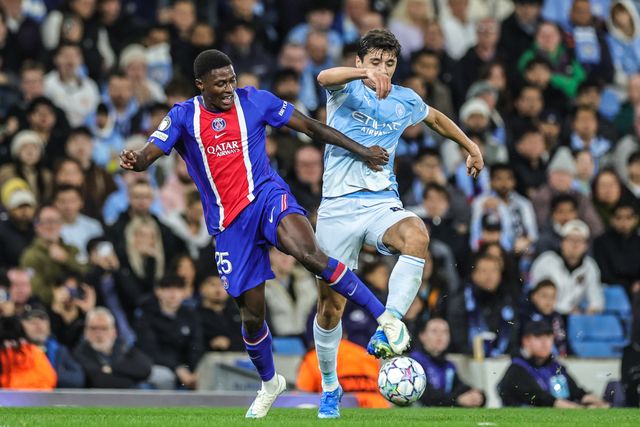 Nuno Mendes of Paris Saint-Germain and Abdukodir Khusanov of Manchester City battle for the ball during the UEFA Champions League Matchday 2 of 8 match Manchester City vs Paris Saint-Germain at City of Manchester Stadium, Manchester, United Kingdom on 14 October 2026

(Photo by Mark Cosgrove/News Images)