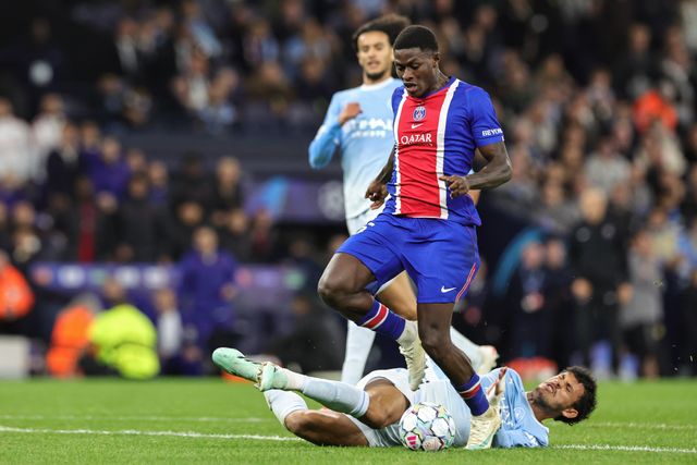 Matheus Nunes of Manchester City fouls Nuno Mendes of Paris Saint-Germain for a penalty during the UEFA Champions League Matchday 2 of 8 match Manchester City vs Paris Saint-Germain at City of Manchester Stadium, Manchester, United Kingdom on 14 October 2026

(Photo by Mark Cosgrove/News Images)
