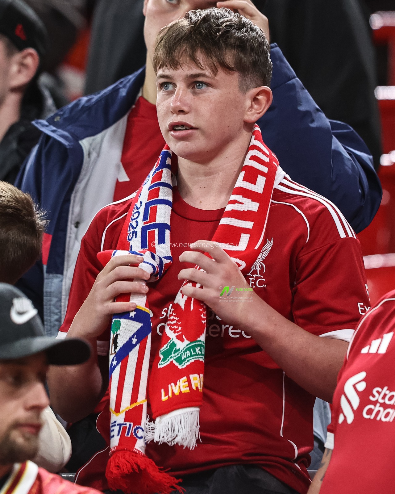 A Liverpool fan with a half an half Liverpool v Atletico Madrid scarf on during the UEFA Champions League, League Stage Liverpool vs Atletico Madrid at Anfield, Liverpool, United Kingdom, 17th September 2025

(Photo by Alfie Cosgrove/News Images)