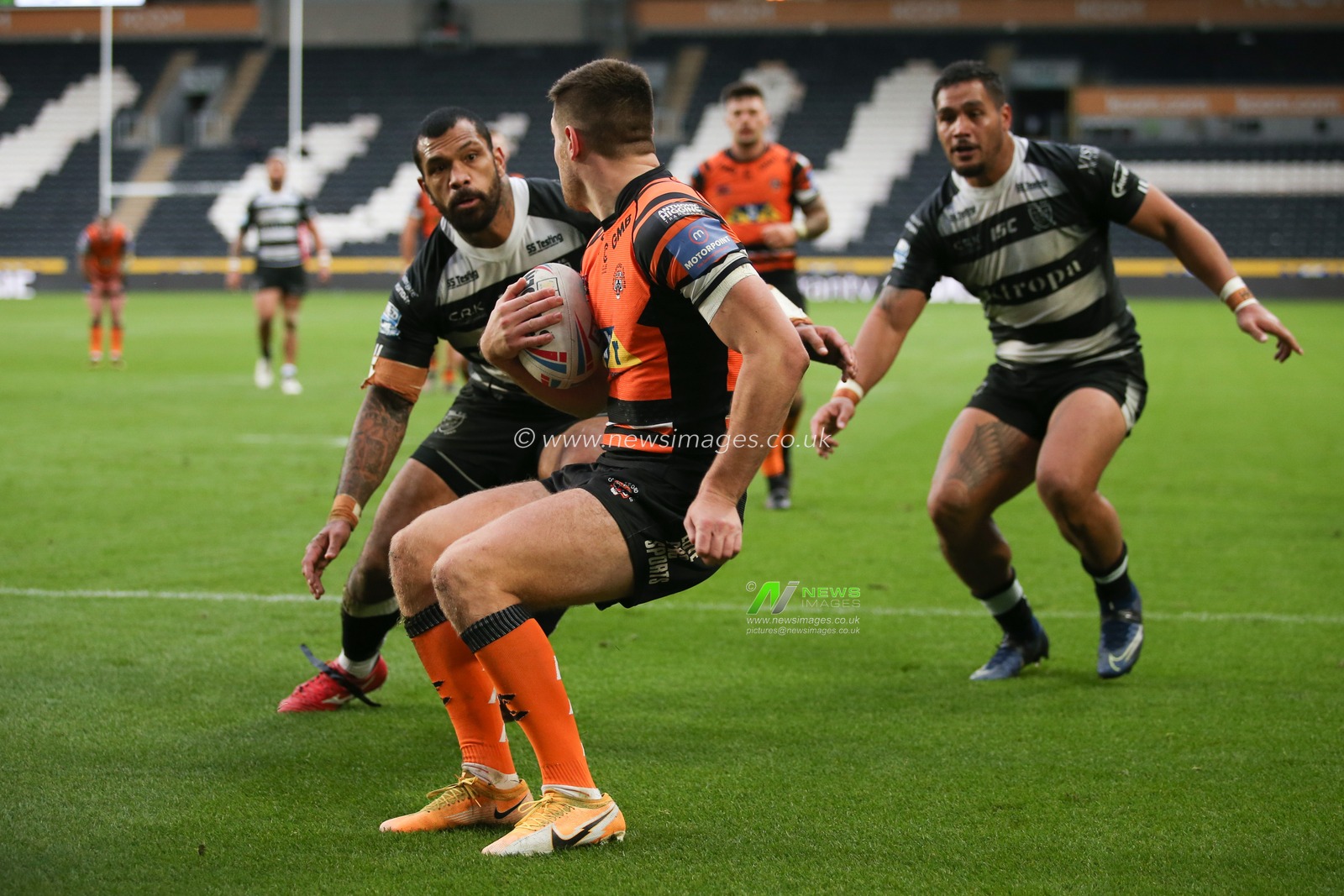 Manu Ma'u (12) of Hull FC and Bureta Faraimo (2) of Hull FC charge down the high kick