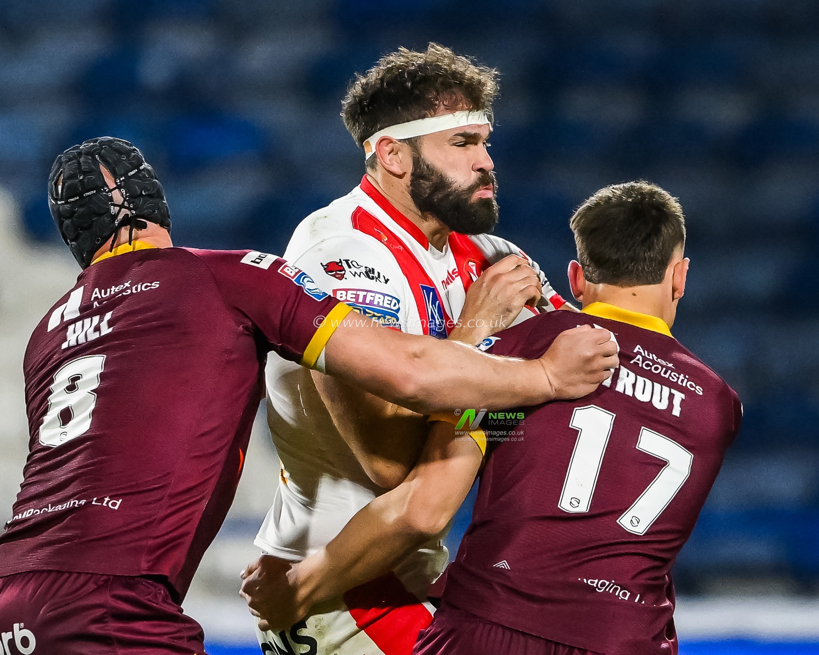 Alex Walmsley #8 of St Helens is tackled by Owen Trout #17 and Chris Hill #8 of Huddersfield Giants during the Betfred Super League Round 6 match Huddersfield Giants vs St Helens at John Smith's Stadium, Huddersfield, United Kingdom, 23rd March 2023

(Photo by Craig Thomas/News Images)