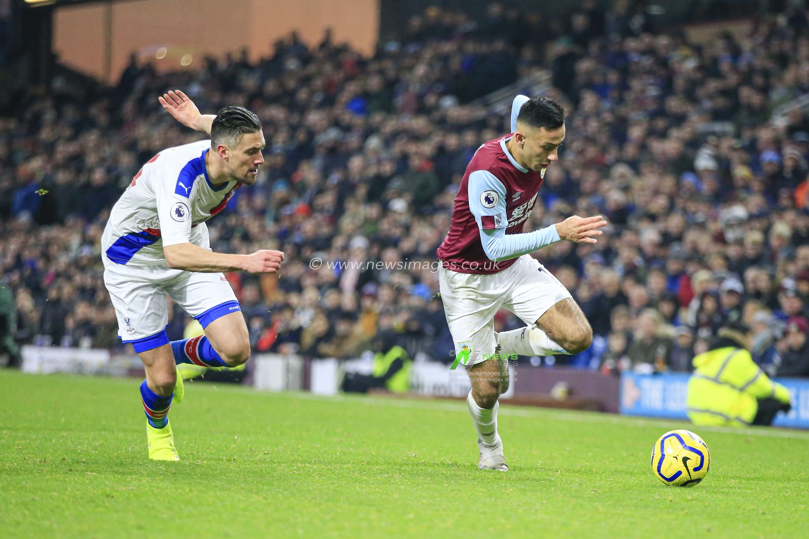 30th November 2019, Turf Moor, Burnley, England; Premier League, Burnley v Crystal Palace :Dwight McNeil (11) of Burnley tries to get past Martin Kelly (34) of Crystal Palace 

Credit: Conor Molloy/News Images
