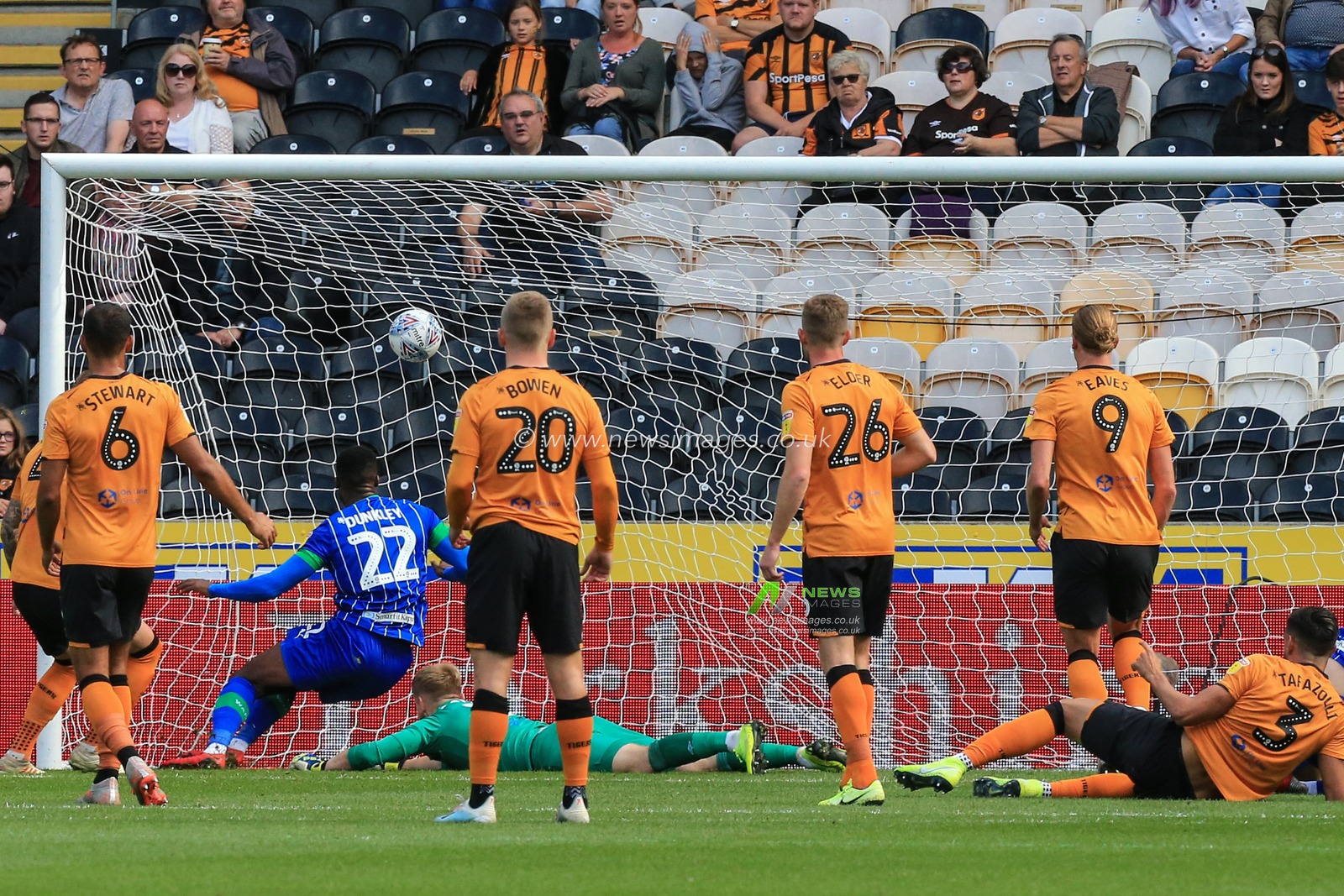 13th September 2019 , KCOM Stadium, Hull , England; Sky Bet Championship Football, Hull City vs Wigan Athletic ; Chey Dunkley (22) of Wigan Athletic scores the first goal of the afternoon

Credit:   David Greaves/News Images

English Football League images are subject to DataCo Licence