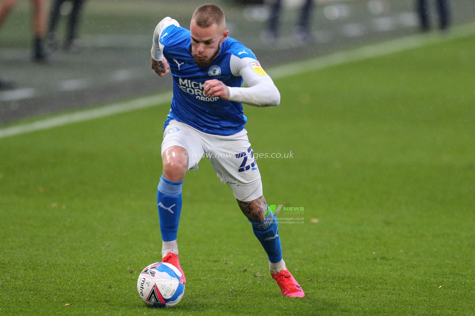 Joe Ward (23) of Peterborough United in action during the game