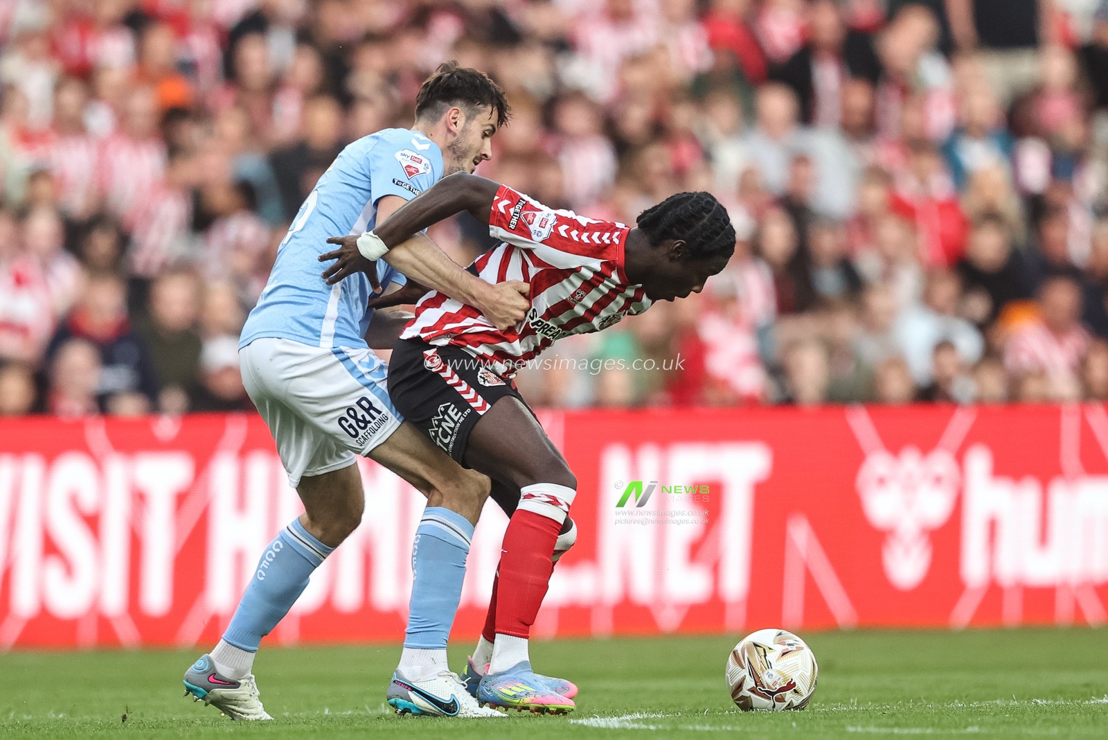 Eliezer Mayenda of Sunderland is fouled by Liam Kitching of Coventry City during the Sky Bet Championship Playoff Semi-final match Sunderland vs Coventry City at Stadium Of Light, Sunderland, United Kingdom, 13th May 2025

(Photo by Alfie Cosgrove/News Images)