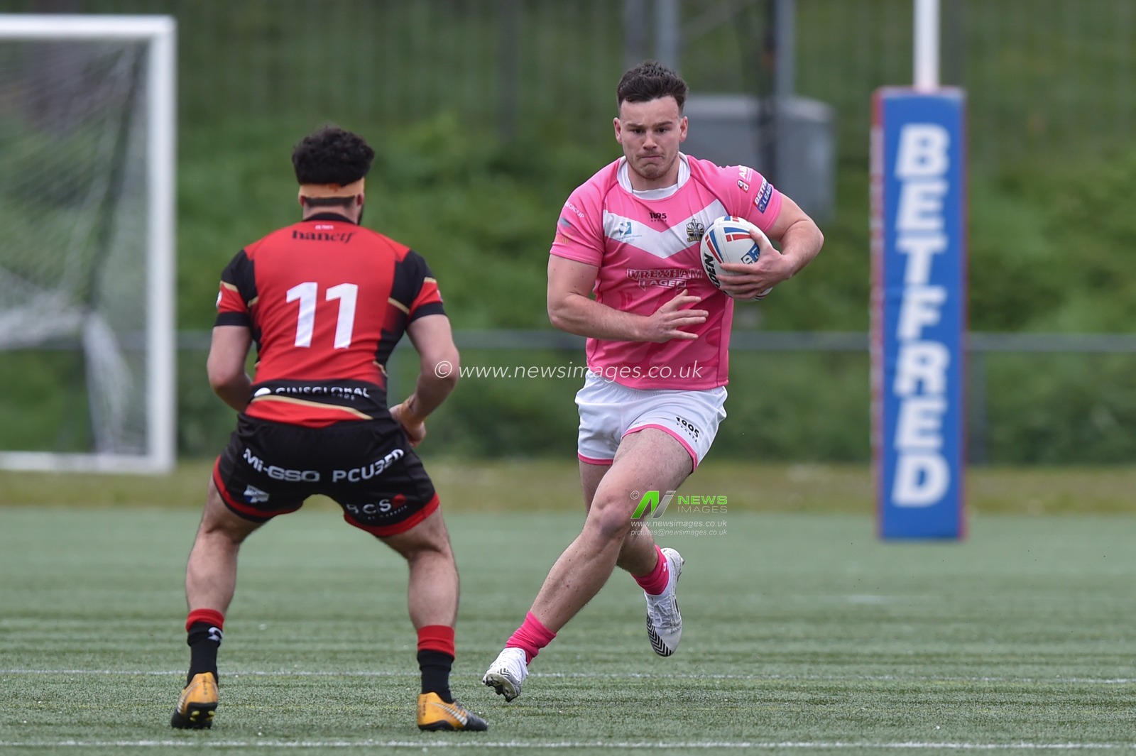 Alex Eckley of North Wales Crusaders  ahead of Adam Vrahnos of London Skolars