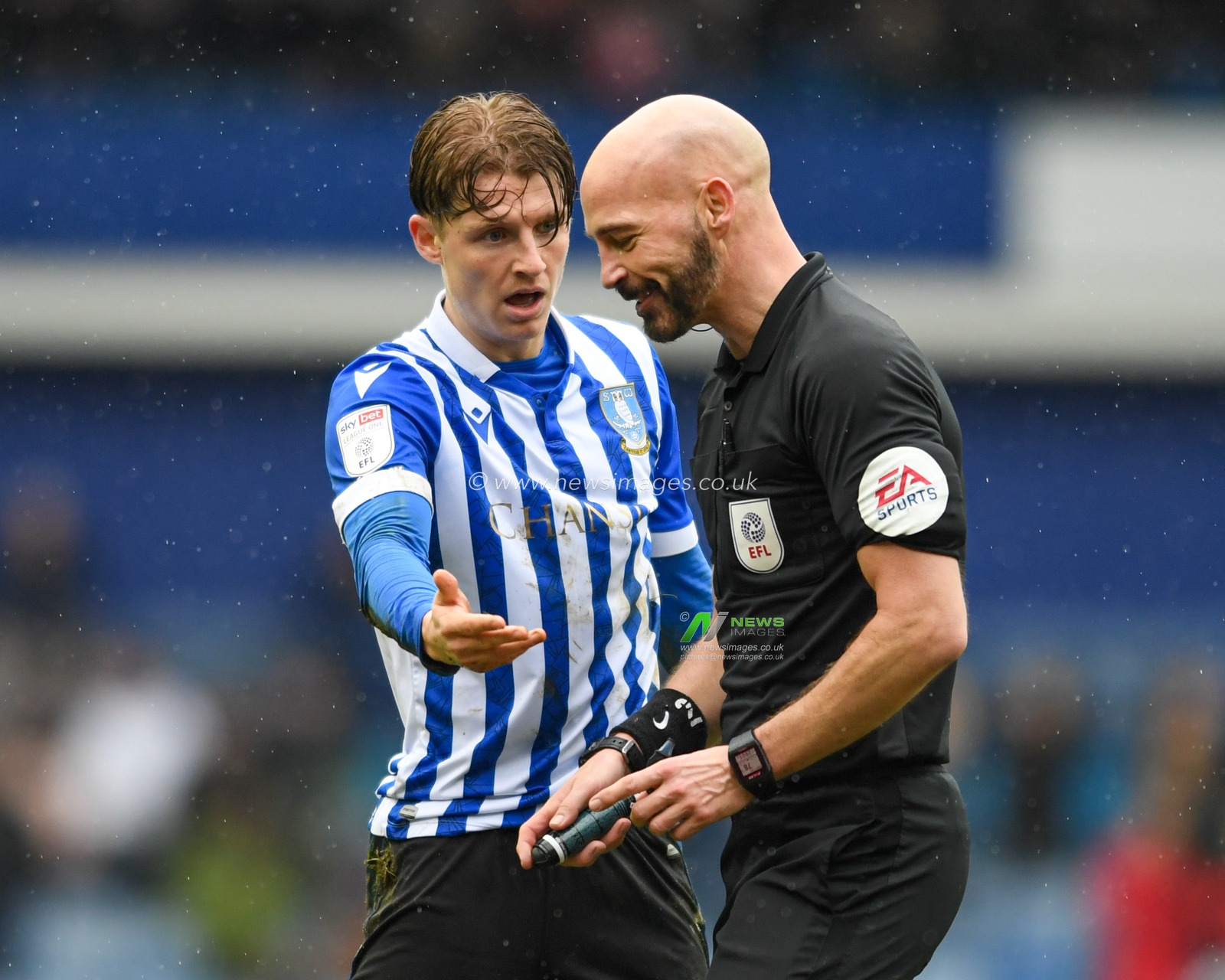 George Byers #14 of Sheffield Wednesday queries a decision with referee Darren Drysdale
