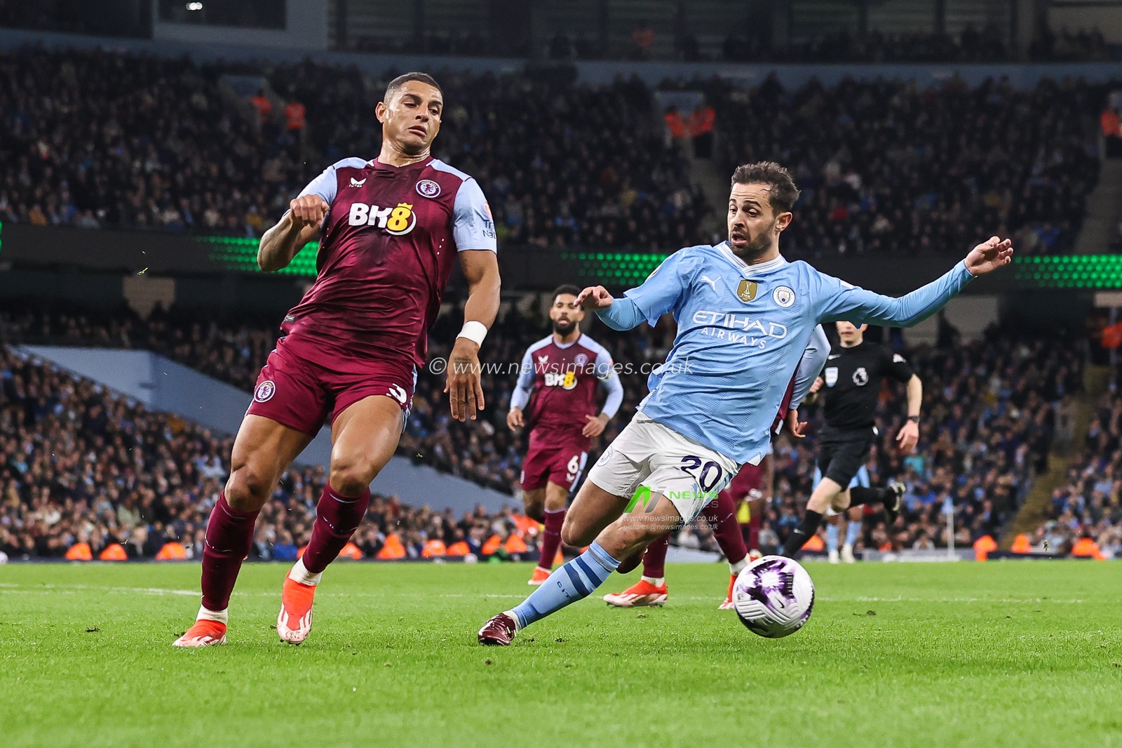 Diego Carlos of Aston Villa clears the ball despite pressure from Bernardo Silva of Manchester City during the Premier League match Manchester City vs Aston Villa at Etihad Stadium, Manchester, United Kingdom, 3rd April 2024

(Photo by Mark Cosgrove/News Images)