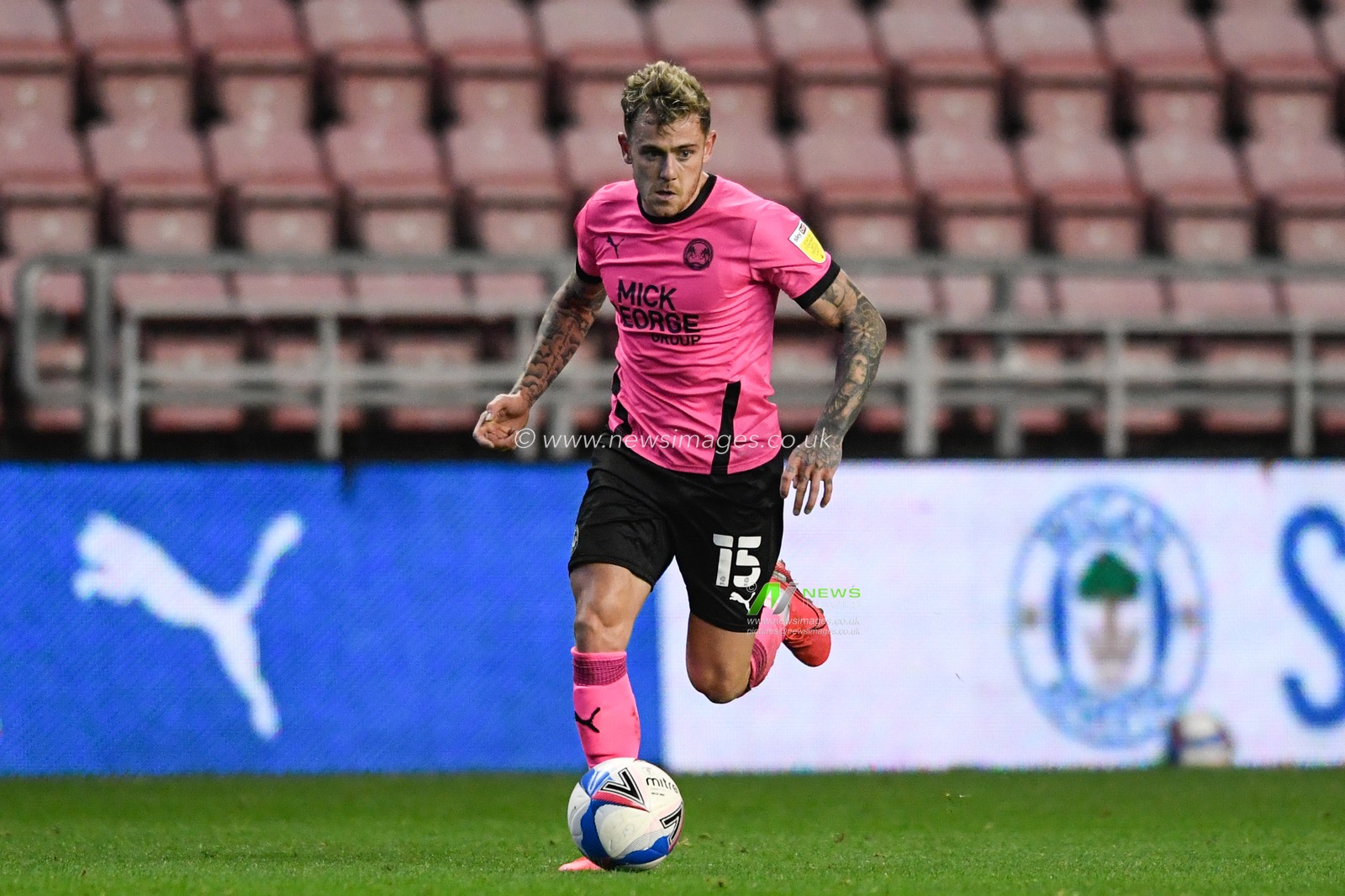 Sammie Szmodics (15) of Peterborough United runs forward with the ball