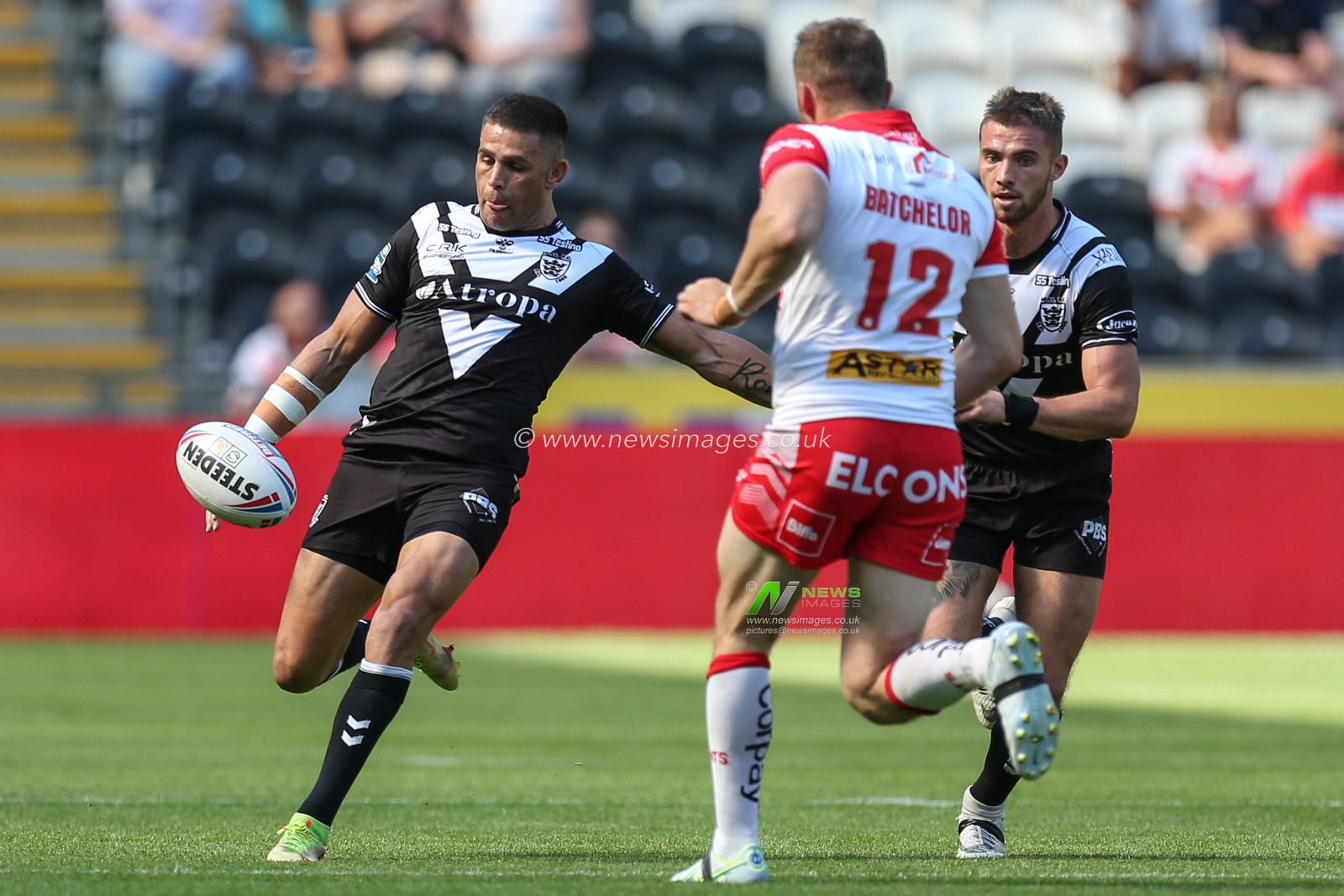 Will Smith #40 of Hull FC puts a high kick up the pitch