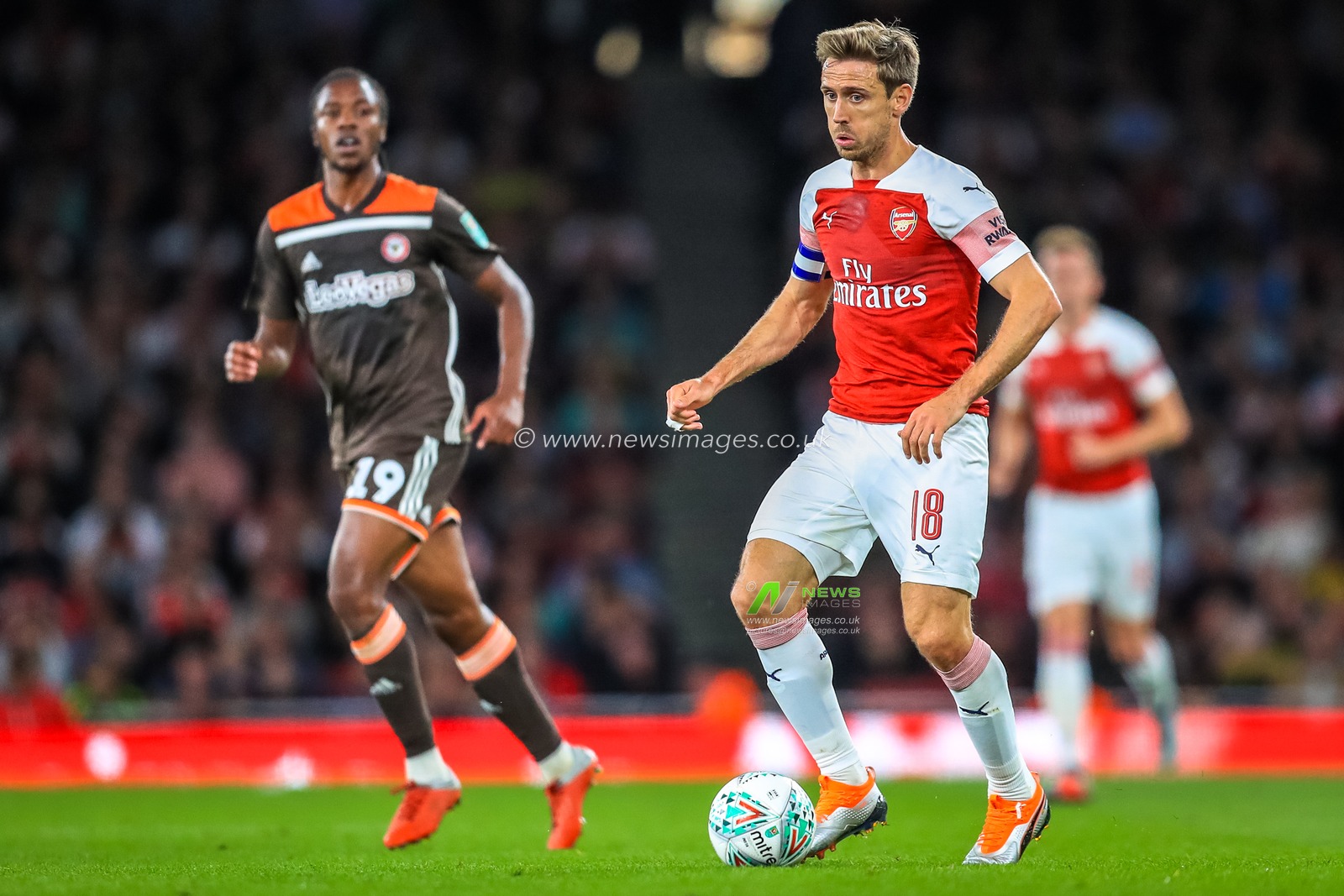26th September 2018, Emirates Stadium, London, England; Carabao EFL Cup, Third round, Arsenal v Brentford ;  Nacho Monreal (18) of Arsenal on the ball.

Credit:  Georgie Kerr/News Images

English Football League images are subject to DataCo Licence