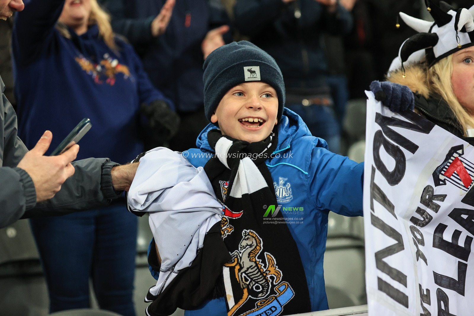 A young Newcastle fan if joyous after receiving Joelinton #7 of Newcastle Unitedâ€™s match worn shirt