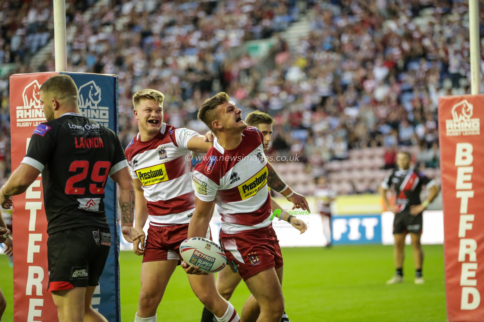 28th June 2019 , DW Stadium, Wigan, England;  Betfred Super League, Round 20, Wigan Warriors vs Salford Red Devils ; Oliver Partington (24) of Wigan Warriors celebrates his try as Wigan win Salford and move up into 5th

Credit: Mark Cosgrove/News Images