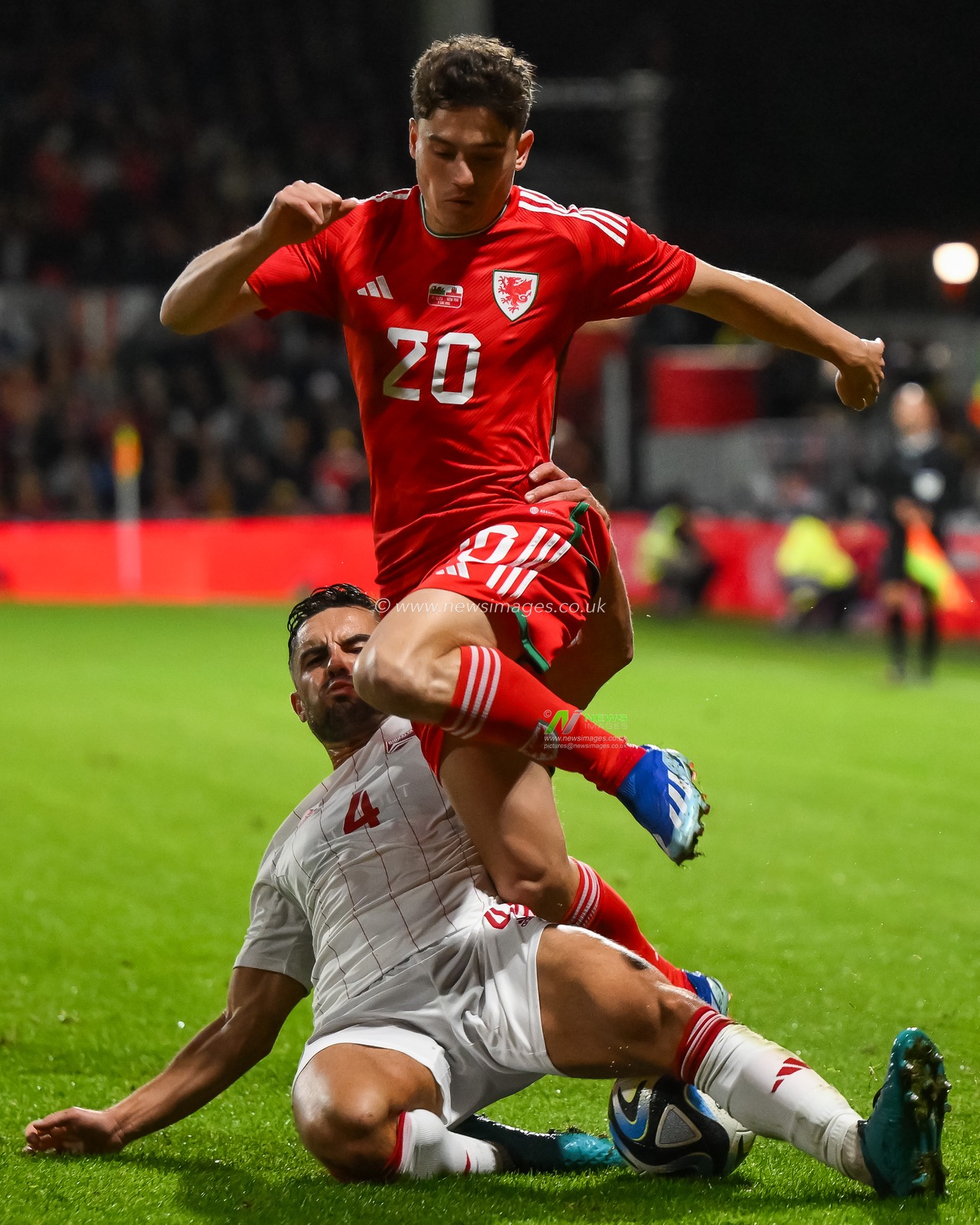Dan James of Wales is tackled by John Sergeant of Gibraltar during the International Friendly match Wales vs Gibraltar at SToK Cae Ras, Wrexham, United Kingdom, 11th October 2023

(Photo by Craig Thomas/News Images)