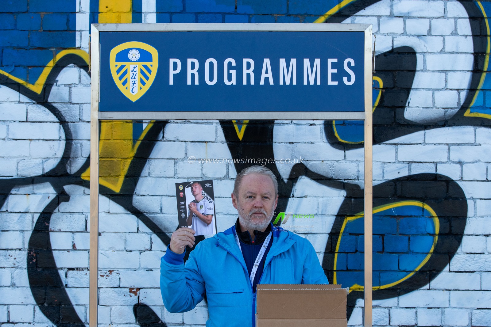 A man sells programmes outside Elland Road Stadium ahead of the Premier League match Leeds United vs Arsenal at Elland Road, Leeds, United Kingdom, 16th October 2022

(Photo by James Heaton/News Images)