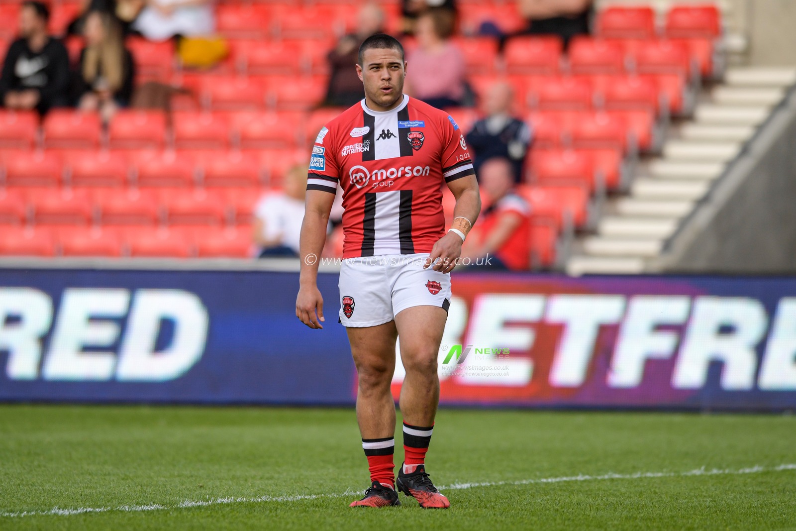 Tui Lolohea (6) of Salford Red Devils in action during the game