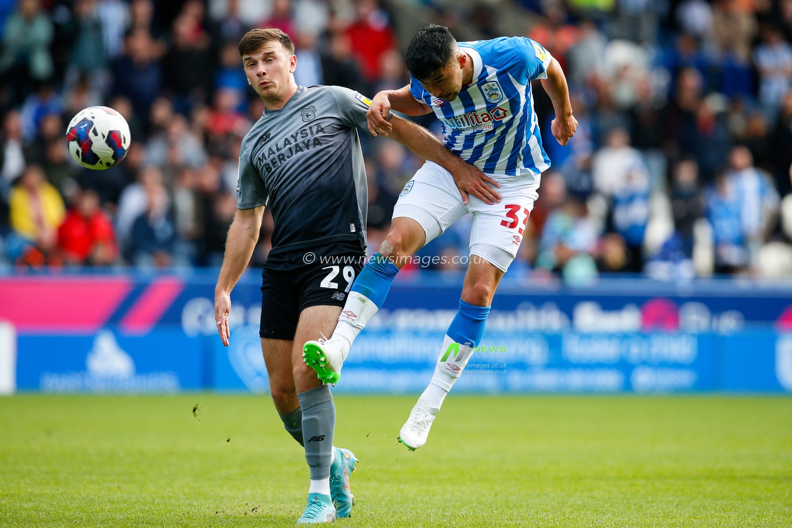 Yuta Nakayama #33 of Huddersfield Town and Mark Harris #29 of Cardiff City during the Sky Bet Championship match Huddersfield Town vs Cardiff City at John Smith's Stadium, Huddersfield, United Kingdom, 17th September 2022

(Photo by Ben Early/News Images)