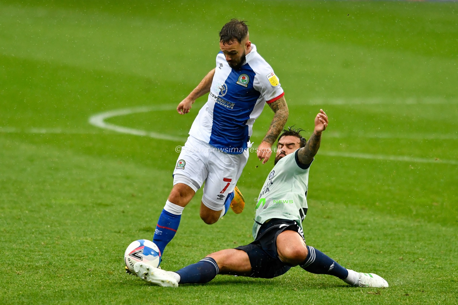 Marlon Pack (21) of Cardiff City takes the ball from Adam Armstrong (7) of Blackburn Rovers with a sliding tackle