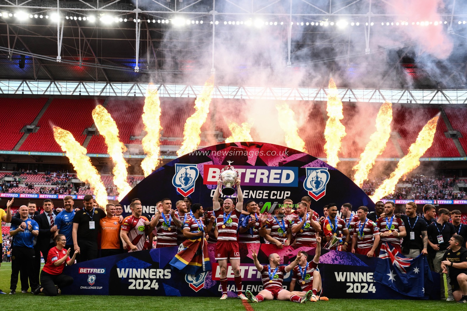 Liam Farrell of Wigan Warriors lifts the Betfred Challenge Cup after the Betfred Challenge Cup Final match Warrington Wolves vs Wigan Warriors at Wembley Stadium, London, United Kingdom, 8th June 2024

(Photo by Craig Thomas/News Images)