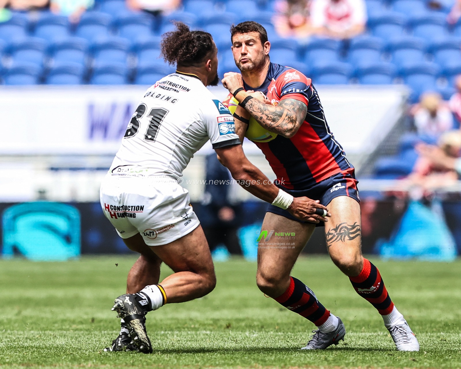 Jay Pitts of Wakefield Trinity is tackled by Ashton Golding of Castleford Tigers during the Betfred Super League Magic Weekend match Wakefield Trinity vs Castleford Tigers at Hill Dickinson Stadium, Liverpool, United Kingdom on 05 July 2026

(Photo by Alfie Cosgrove/News Images)
