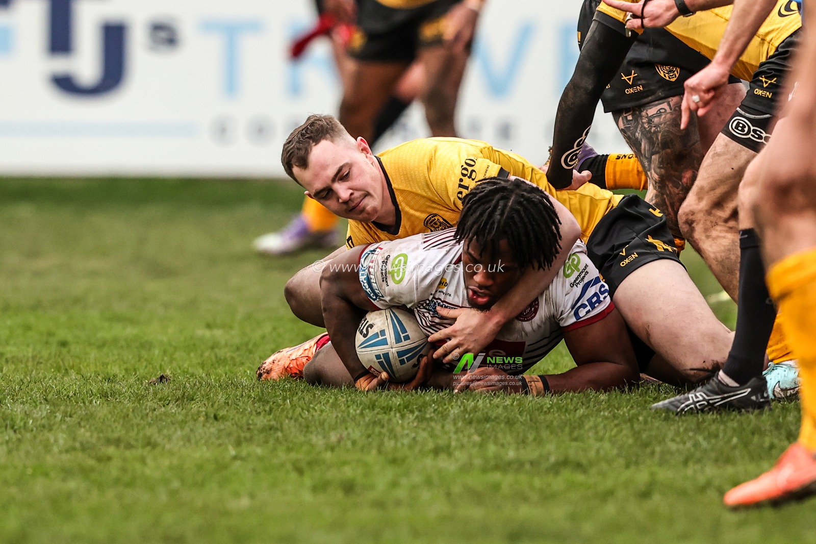 Junior Nsemba of Wigan Warriors is tackled during the Betfred Super League round 1 match Castleford Tigers vs Wigan Warriors at OneBore Stadium, Castleford, Untied Kingdom on 15 February 2026

(Photo by Alfie Cosgrove/News Images)