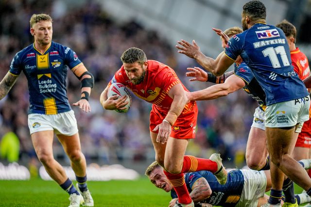 Julian Bousquet of Catalans Dragons is tackled by Danny Levi of Leeds Rhinos during the Betfred Super League round 9 match Leeds Rhinos vs Catalans Dragons at AMT Headingley Stadium, Leeds, United Kingdom on 24 April 2026

(Photo by Maynard Manyowa/News Images)