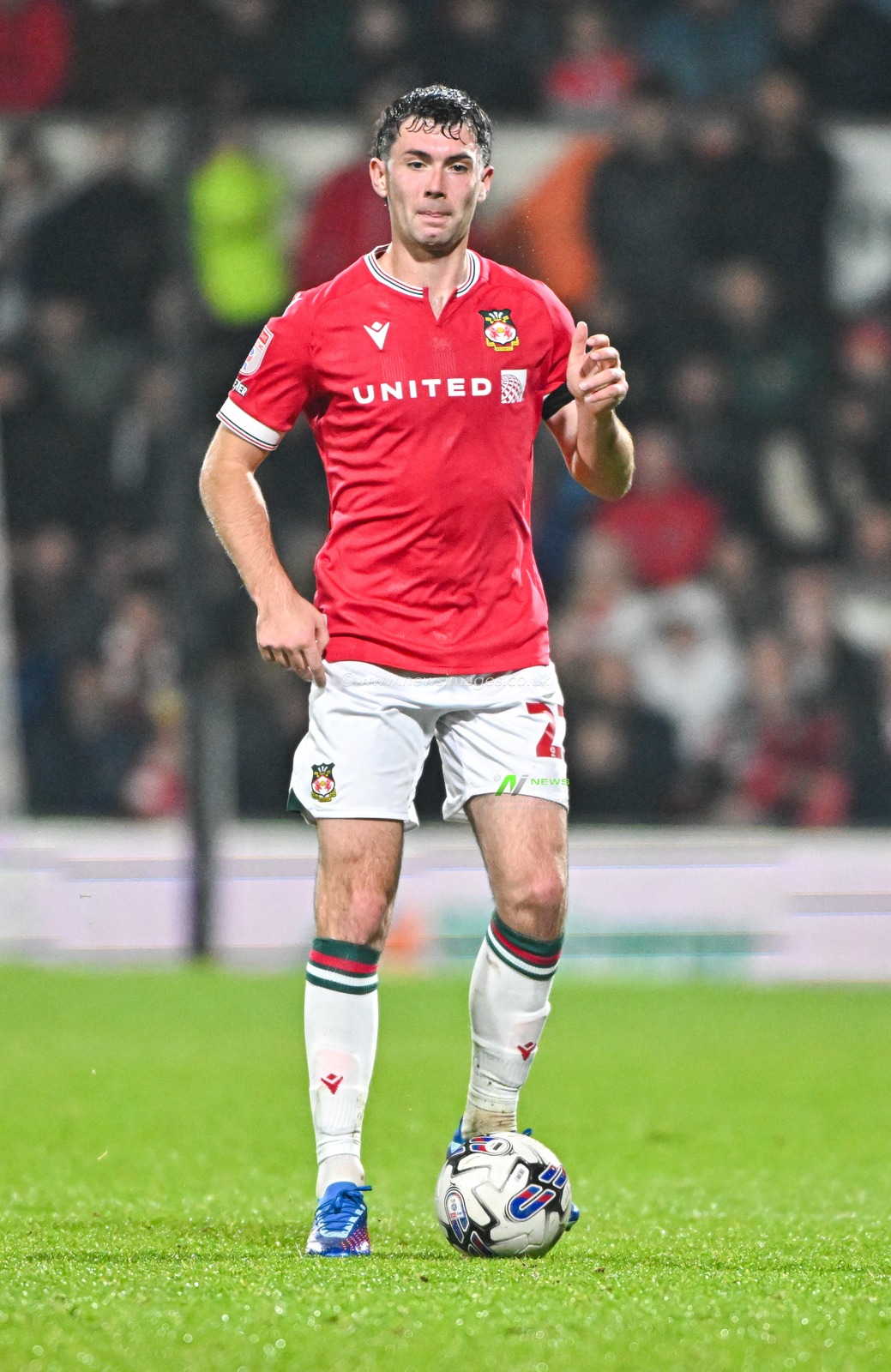 Thomas O'Connor 22# of Wrexham Association Football Club on the ball, during the Sky Bet League 2 match Wrexham vs Sutton United at SToK Cae Ras, Wrexham, United Kingdom, 24th October 2023

(Photo by Cody Froggatt/News Images)