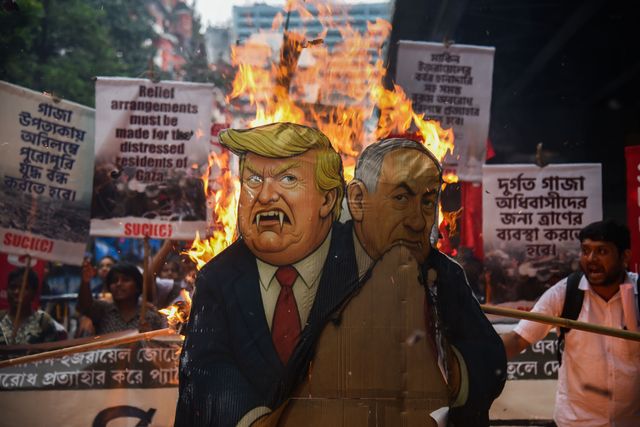 Activists from the Socialist Unity Centre of India (SUCI) burned an effigy of U.S. President Donald Trump and Israeli Prime Minister Benjamin Netanyahu during an anti-Israel protest to express solidarity with Palestinians, in Kolkata on October 7, 2025.Photo by Debajyoti Chakraborty.(Photo: Debajyoti Chakraborty/News Images)