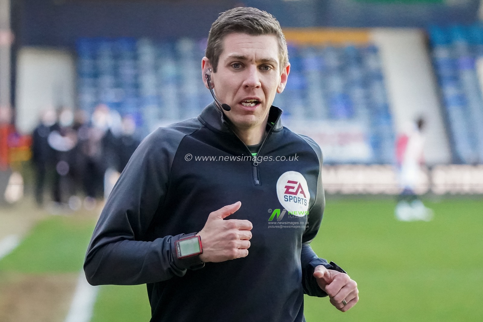 Referee Mark Donohue warms up prior to the game