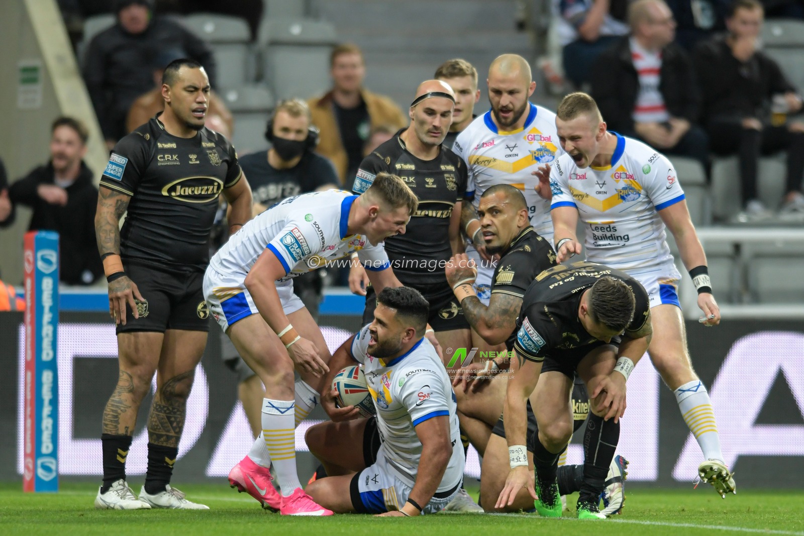 Rhyse Martin (12) of Leeds Rhinos celebrates scoring a try to make it 4-0