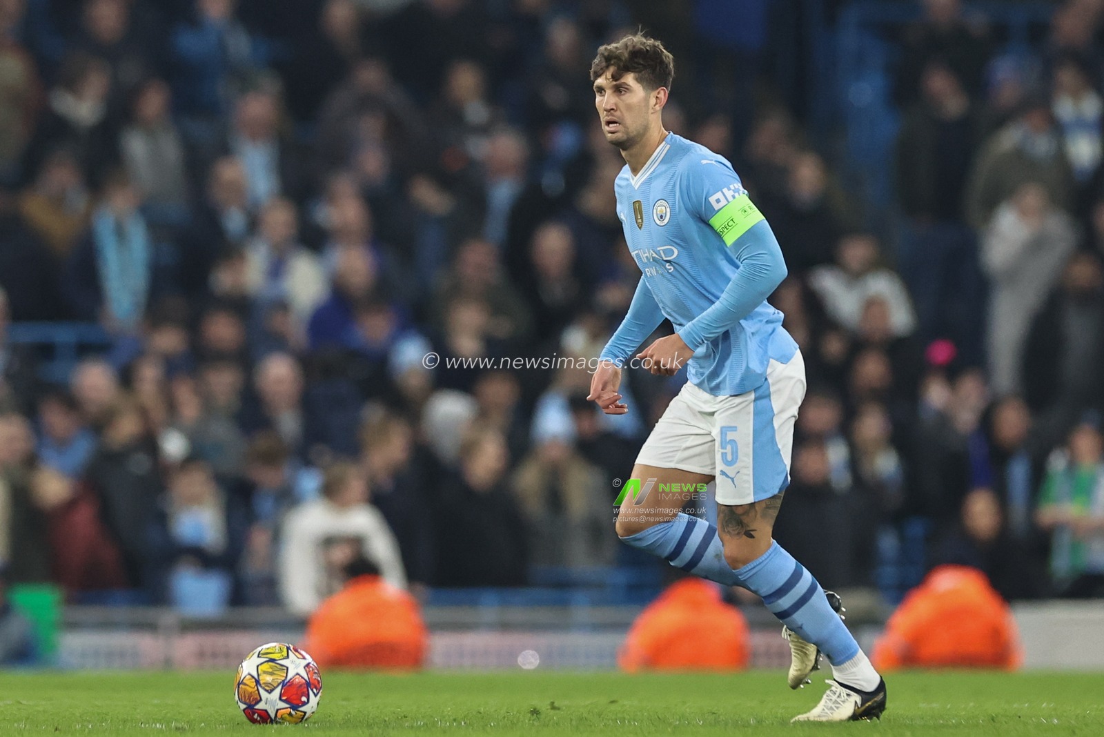 John Stones of Manchester City breaks with the ball during the UEFA Champions League match Manchester City vs F.C. Copenhagen at Etihad Stadium, Manchester, United Kingdom, 6th March 2024

(Photo by Mark Cosgrove/News Images)