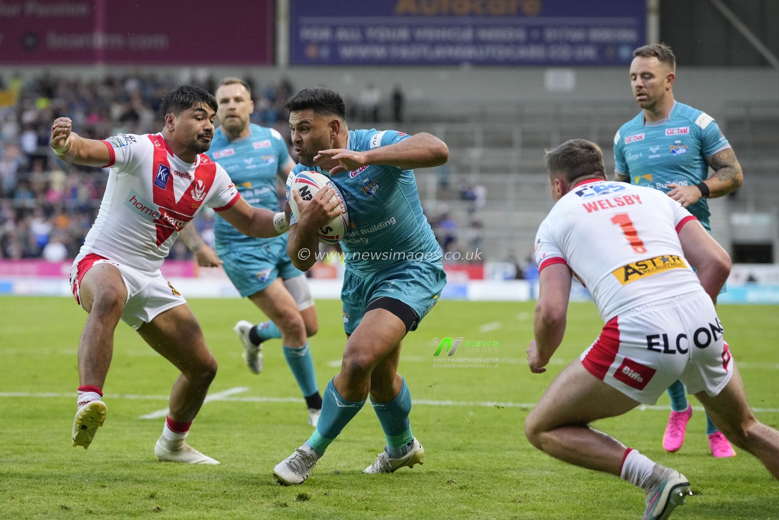 Rhyse Martin #12 of Leeds Rhinos breaks past James Bell #19 of St. Helens to score a try during the Betfred Super League Round 20 match St Helens vs Leeds Rhinos at Totally Wicked Stadium, St Helens, United Kingdom, 28th July 2023

(Photo by Steve Flynn/News Images)