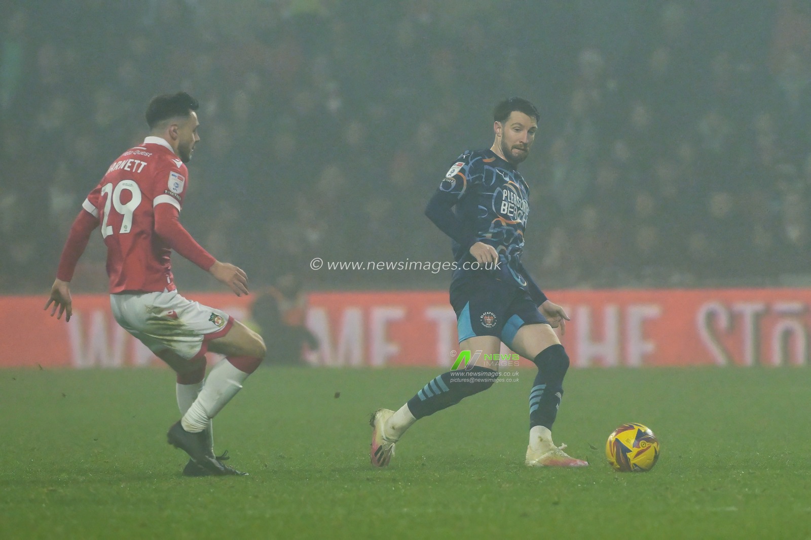 James Husband of Blackpool passes the ball during the Sky Bet League 1 match Wrexham vs Blackpool at SToK Cae Ras, Wrexham, United Kingdom, 26th December 2024

(Photo by Craig Thomas/News Images)