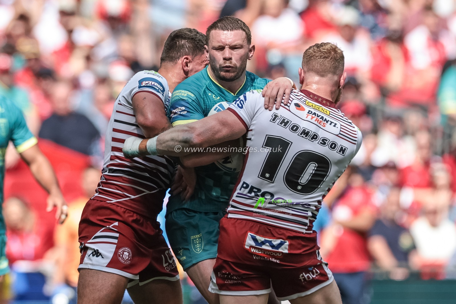 James Batchelor of Hull KR is tackled by Oliver Partington of Wigan Warriors and Luke Thompson of Wigan Warriors during the Betfred Challenge Cup Final match Wigan Warriors vs Hull KR at Wembley Stadium, London, United Kingdom on 30 May 2026

(Photo by Mark Cosgrove/News Images)