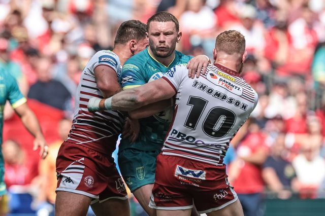 James Batchelor of Hull KR is tackled by Oliver Partington of Wigan Warriors and Luke Thompson of Wigan Warriors during the Betfred Challenge Cup Final match Wigan Warriors vs Hull KR at Wembley Stadium, London, United Kingdom on 30 May 2026

(Photo by Mark Cosgrove/News Images)