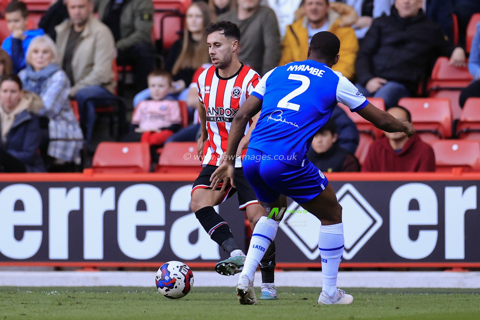 George Baldock #2 of Sheffield United tries to get past Ryan Nyambe #2 of Wigan Athletic during the Sky Bet Championship match Sheffield United vs Wigan Athletic at Bramall Lane, Sheffield, United Kingdom, 7th April 2023

(Photo by Conor Molloy/News Images)