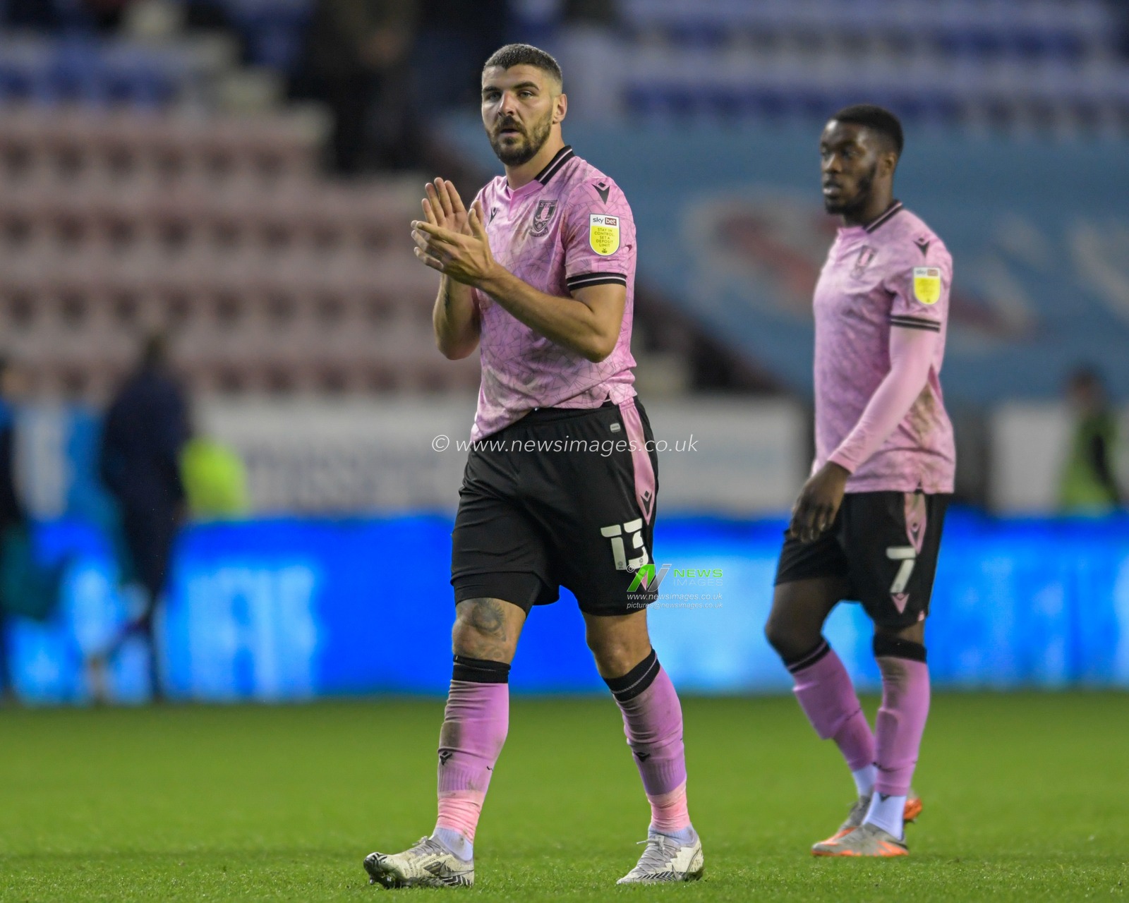 Callum Paterson #13 of Sheffield Wednesday applauds the travelling supporters at the end of the game after his side beat Wigan Athletic 1-2