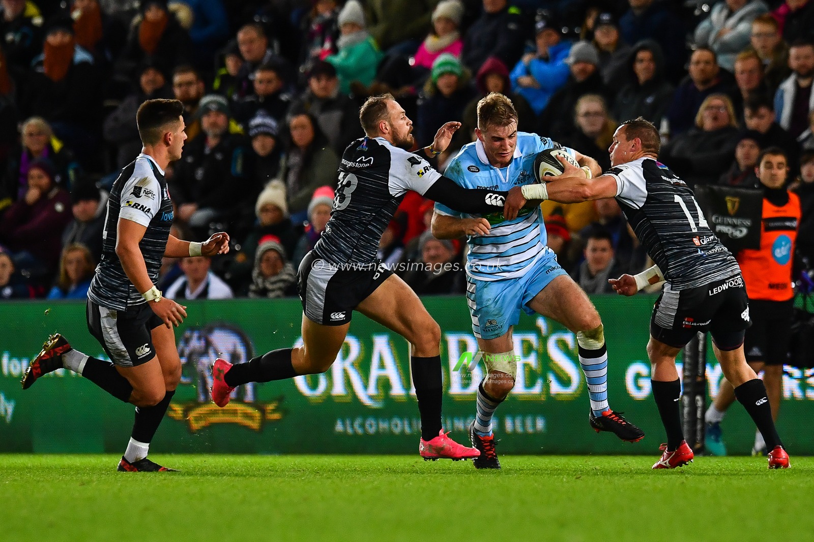 2nd November, Liberty Stadium , Swansea, Wales ; Guinness pro 14's Ospreys Rugby v Glasgow Warriors ; Stafford McDowall of Glasgow Warriors is tackled by Cory Allen and Hanno Dirksen of Ospreys 

Credit: Craig Thomas/News Images