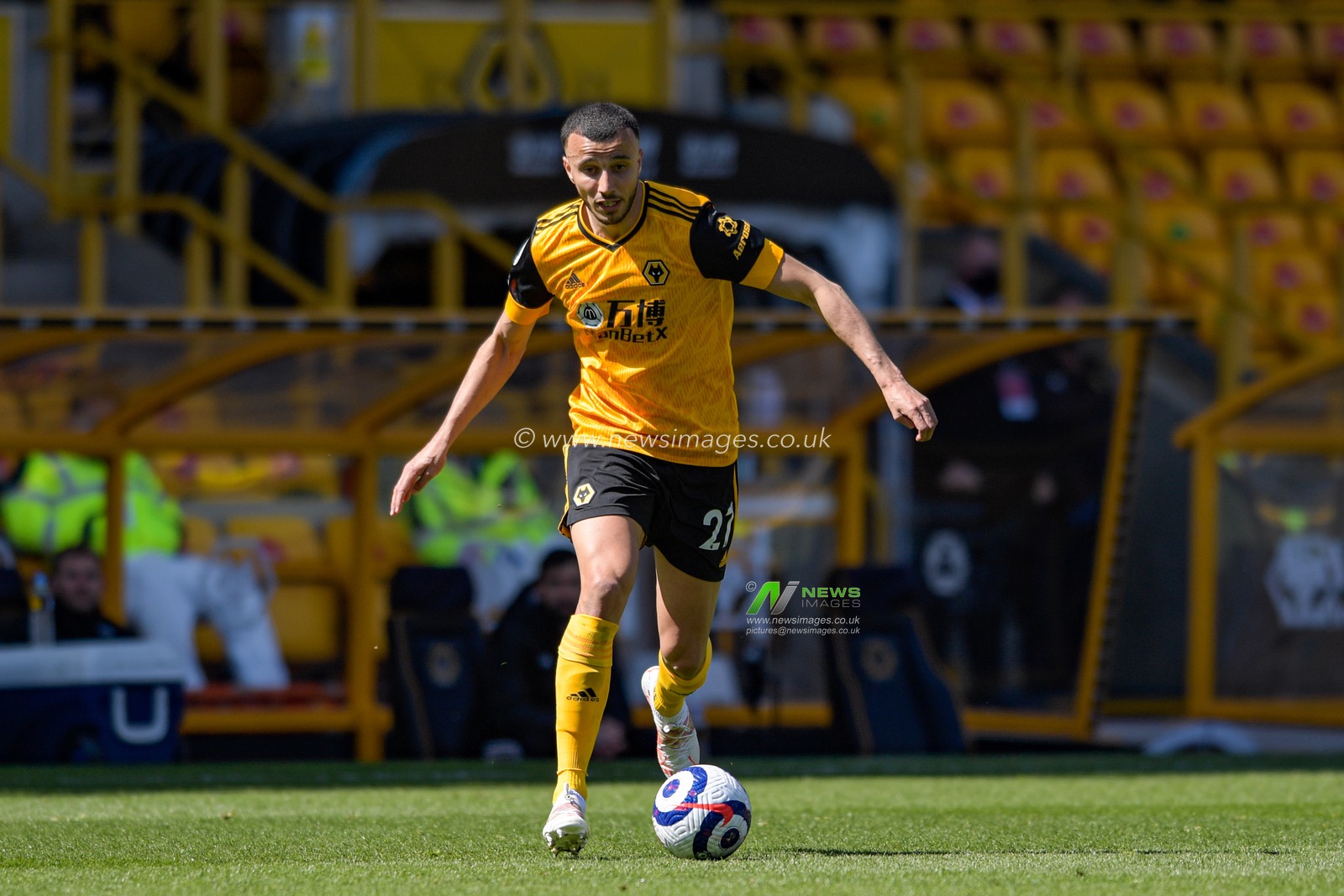 Romain Saiss #27 of Wolverhampton Wanderers runs with the ball
