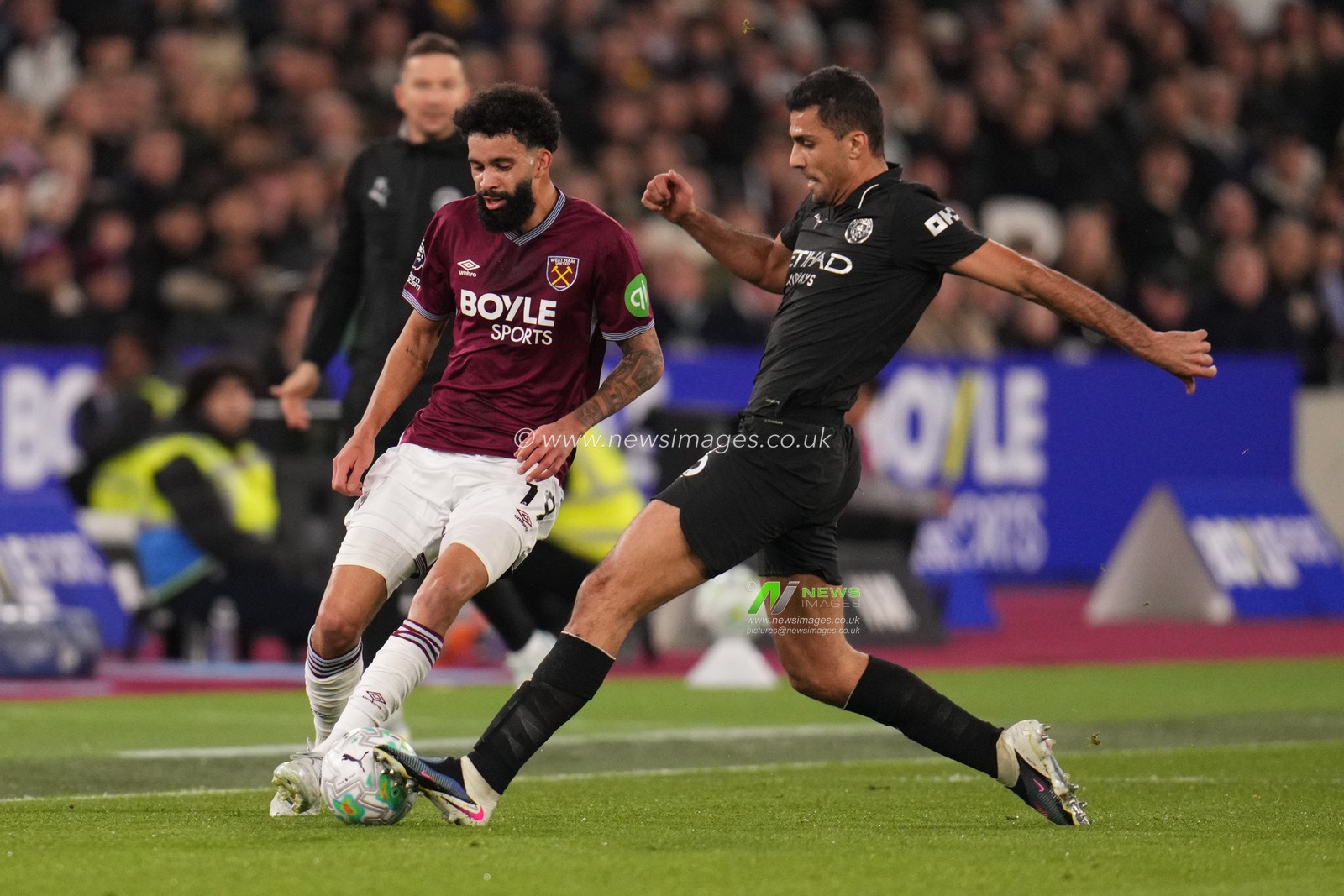Rodri of Manchester City tackles Pablo of West Ham United during the Premier League match West Ham United vs Manchester City at London Stadium, London, United Kingdom on 14 March 2026

(Photo by Harvey Murphy/News Images)