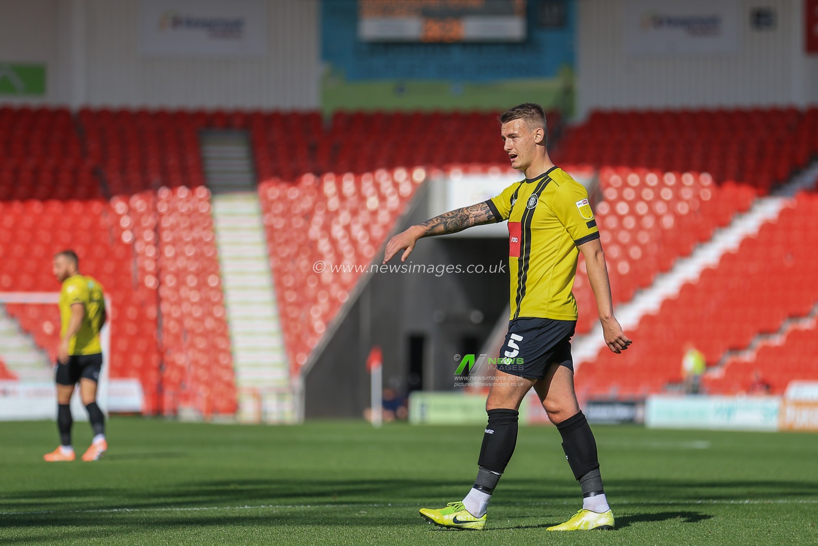 Will Smith (5) of Harrogate Town in action