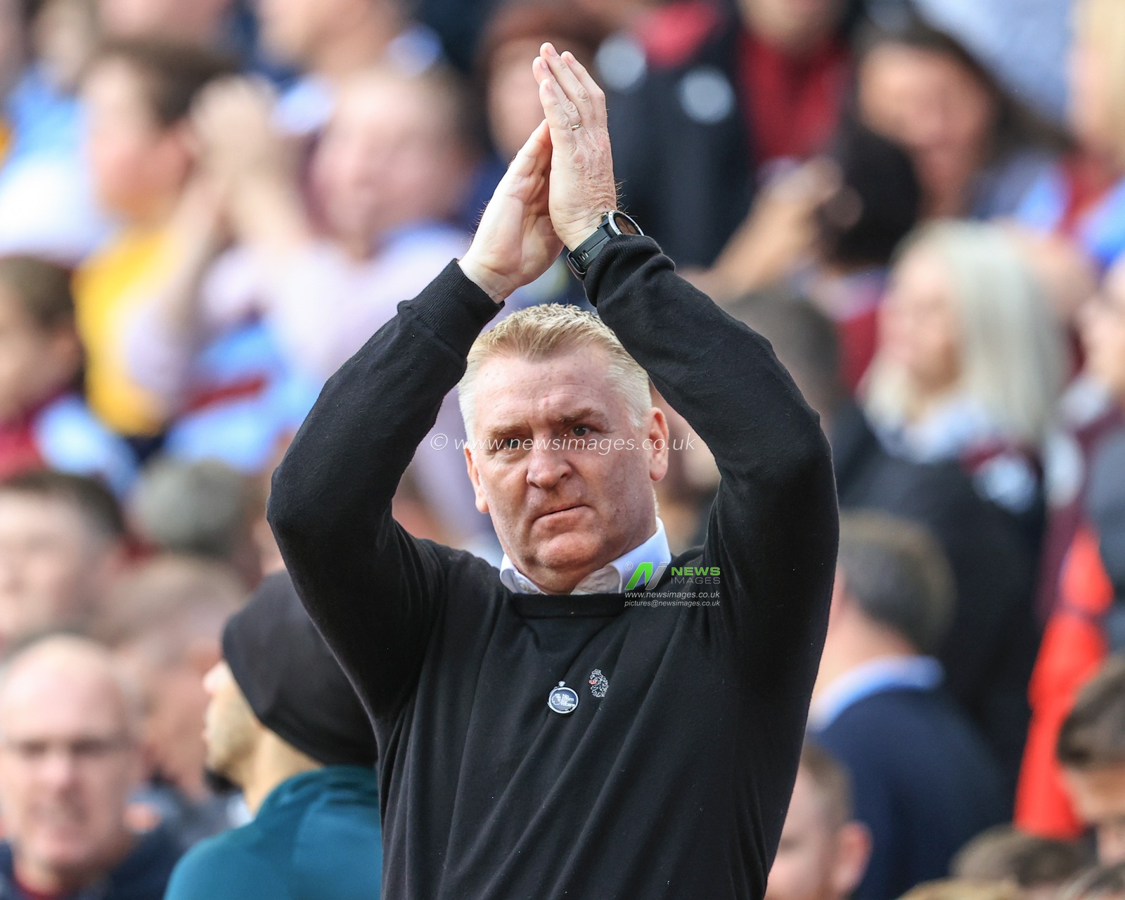 Dean Smith manager of Aston Villa applauds the fans as he walks out for kick-off