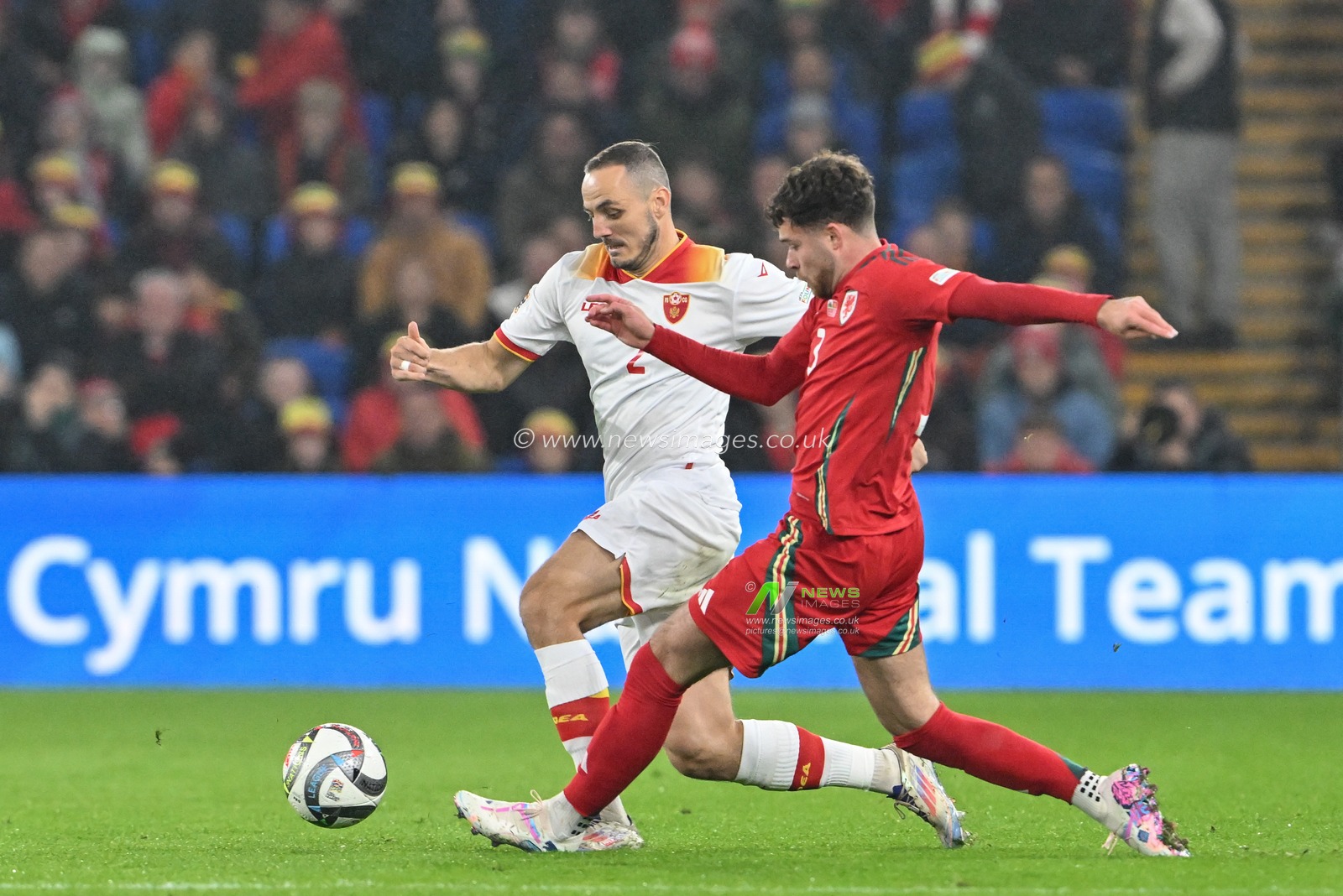 Andrija VukÄeviÄ‡ of Montenegro is fouled by Neco Williams of Wales during the UEFA Nations League - League B - Group 4 match Wales vs Montenegro at Cardiff City Stadium, Cardiff, United Kingdom, 14th October 2024

(Photo by Cody Froggatt/News Images)