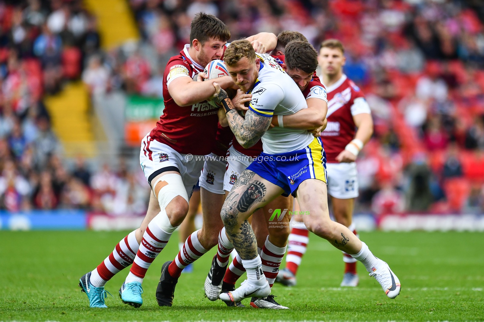 25th May 2019 , Anfield Stadium, Liverpool, England; Dacia Magic Weekend, Betfred Super League Round 16, Wigan Warriors vs Warrington Wolves ; Josh Charnley (5) of Warrington Wolves Joe Greenwood (11) of Wigan Warriors 

Credit: Craig Thomas/News Images