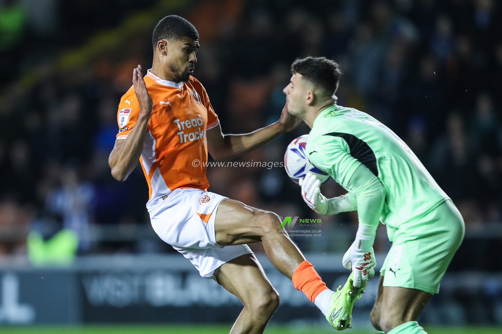 Ashley Fletcher of Blackpool fouls Sam Tickle of Wigan Athletic during the Sky Bet League 1 match Blackpool vs Wigan Athletic at Bloomfield Road, Blackpool, United Kingdom, 28th October 2024

(Photo by Gareth Evans/News Images)