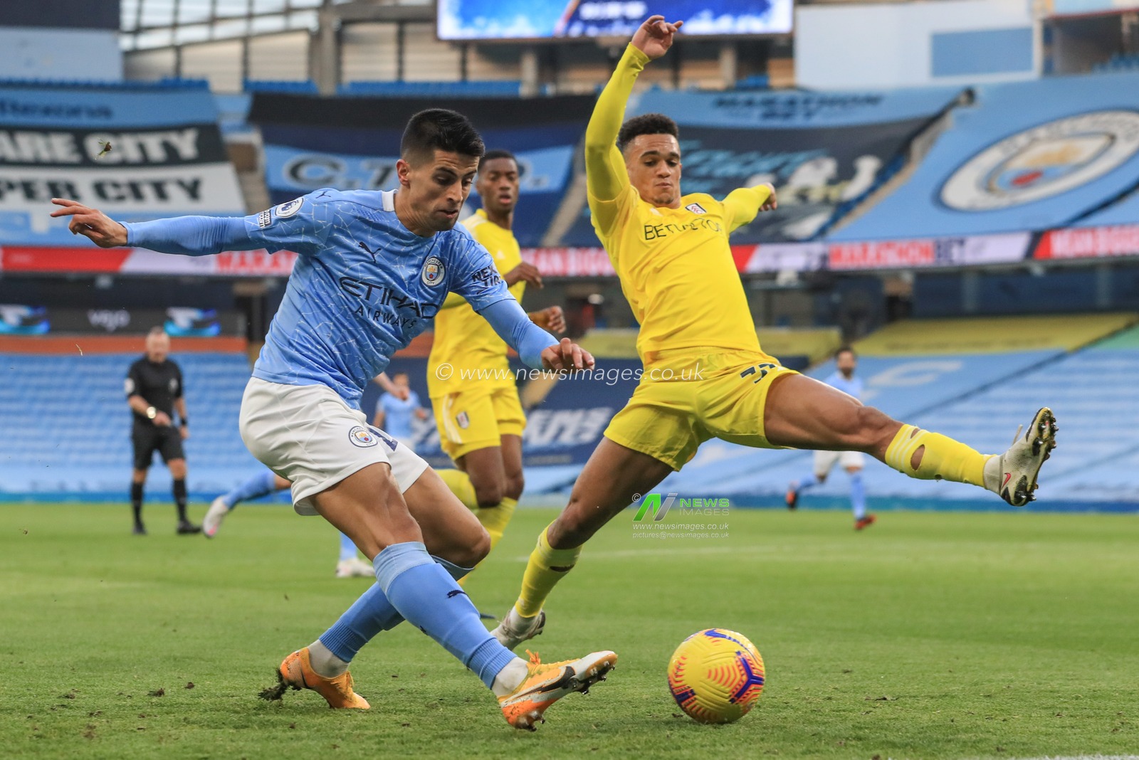 Joao Cancelo #27 of Manchester City shoots on goal